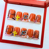 Duck press on nails in orange tiger stripe with 3D rhinestone kitty charm by GAGUGAGU