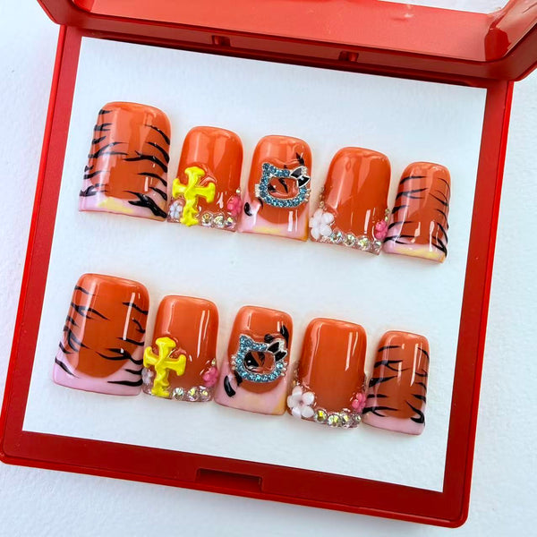 Duck press on nails in orange tiger stripe with 3D rhinestone kitty charm by GAGUGAGU