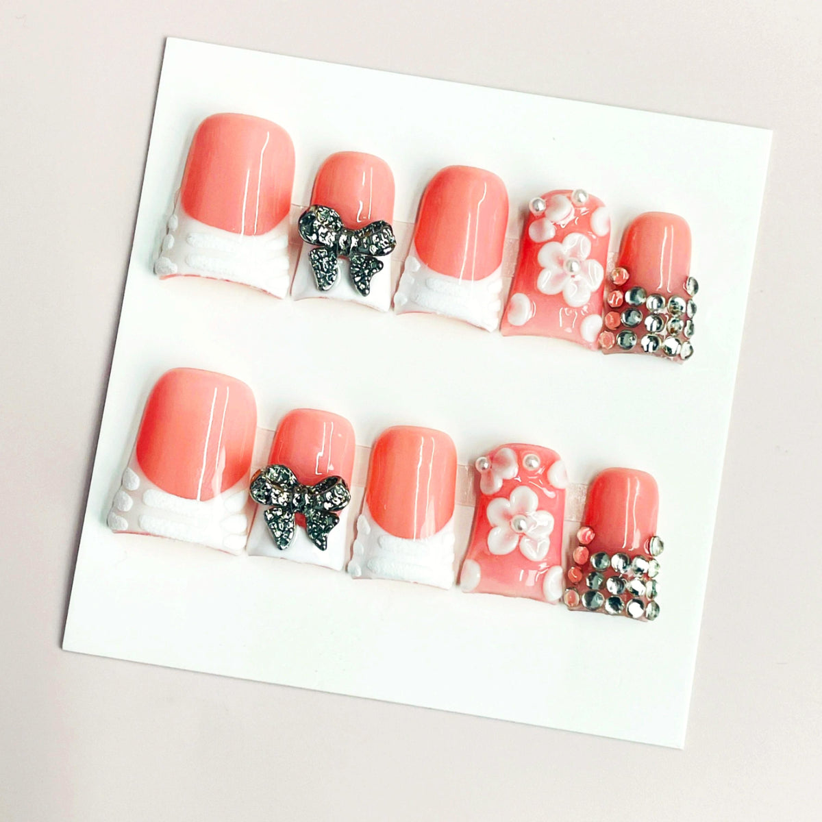 Duck Press On Nails - Coral pink base, white quilted french tips, 3...
